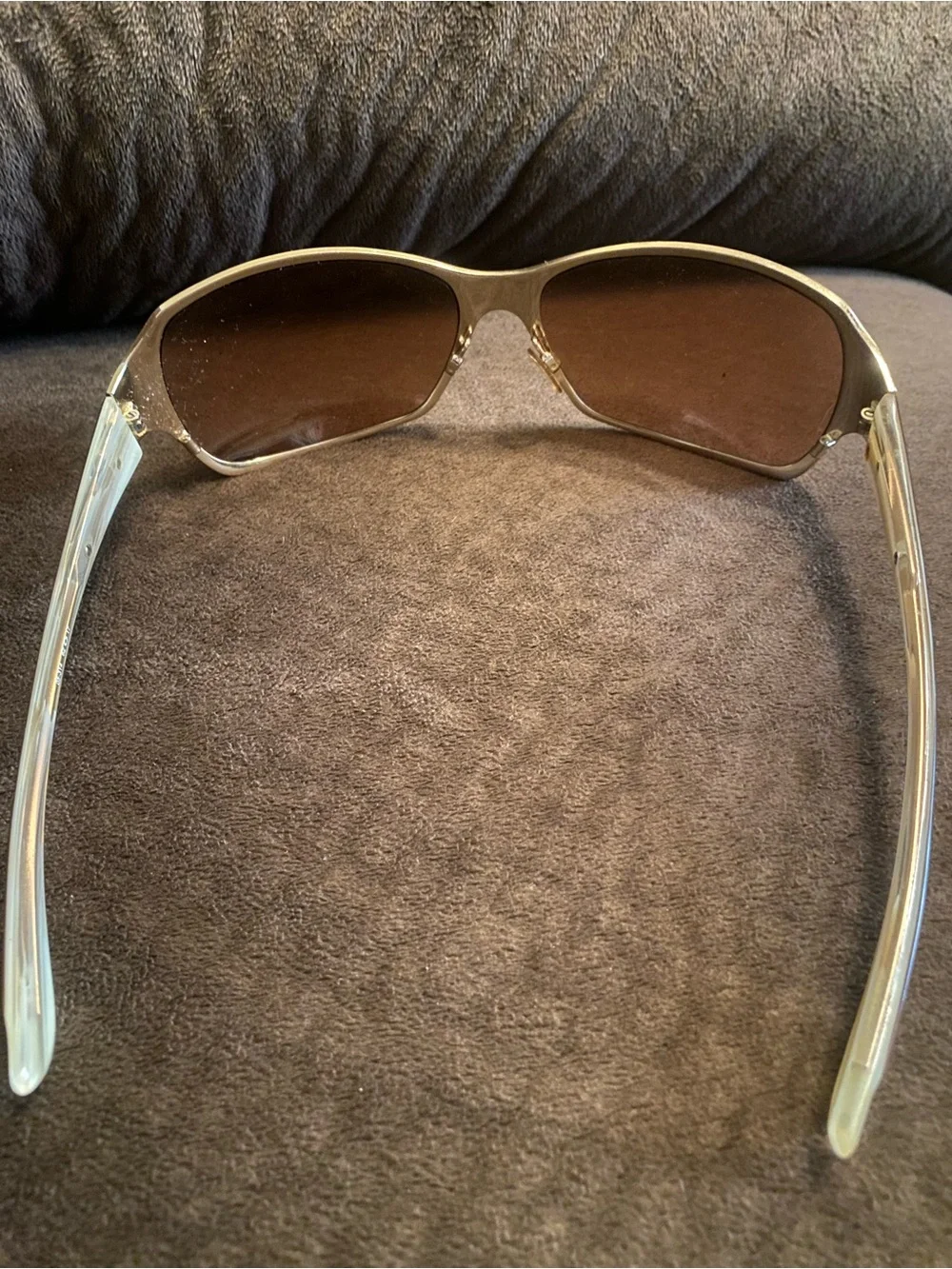 Oakley Silver Frame Sunglasses with Brown Lenses